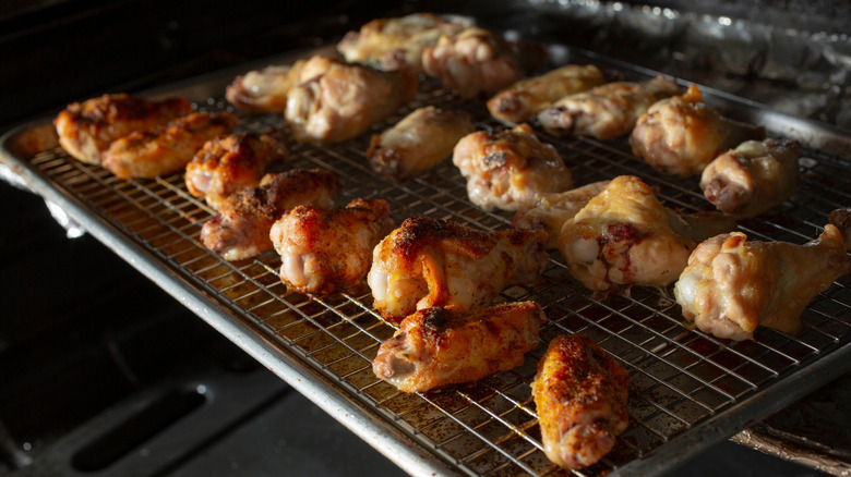 chicken wings on a wire rack in oven