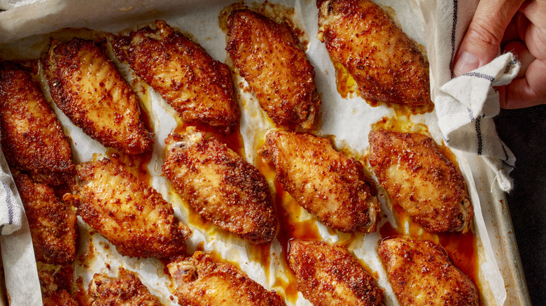 chicken wings on parchment paper lined tray