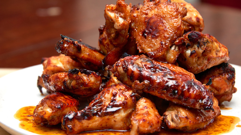 pile of sauced chicken wings on plate