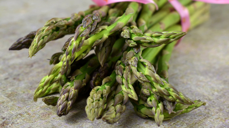 fresh asparagus in grey background