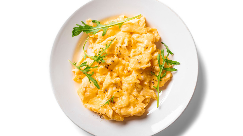 white plate of scrambled eggs