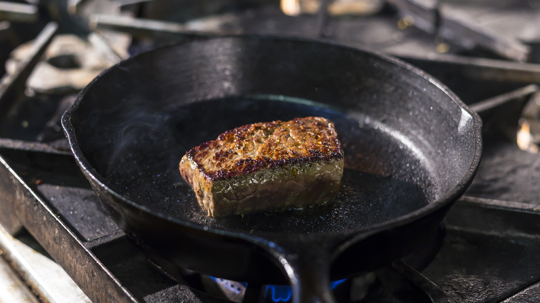 Steak searing over high heat