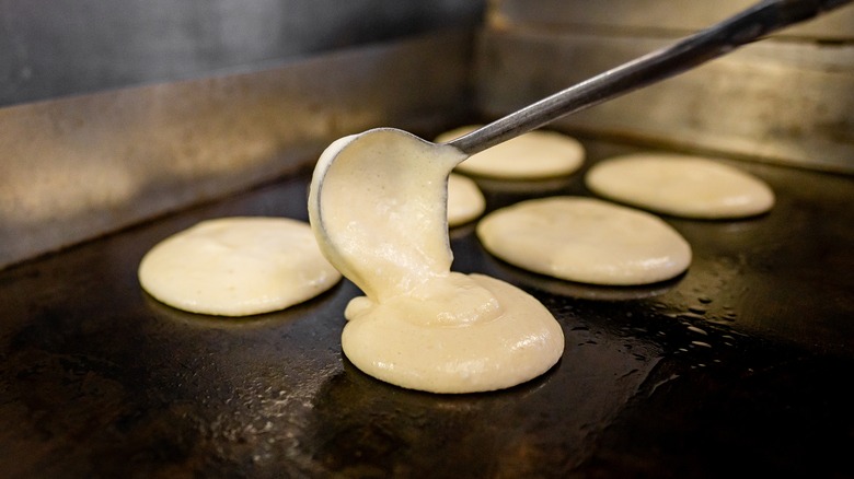 Pancakes cooking on griddle