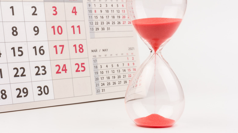 A calendar and an hourglass