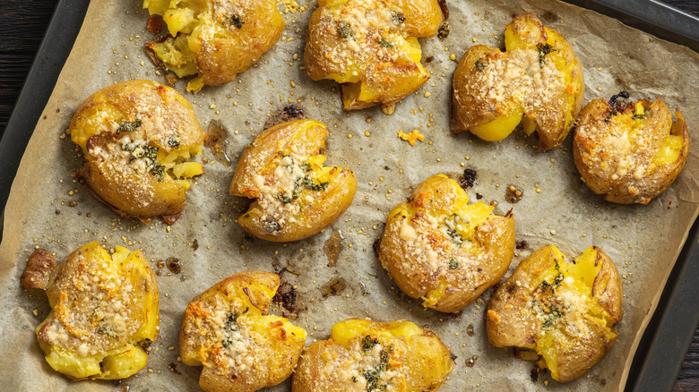 smashed potatoes on baking sheet