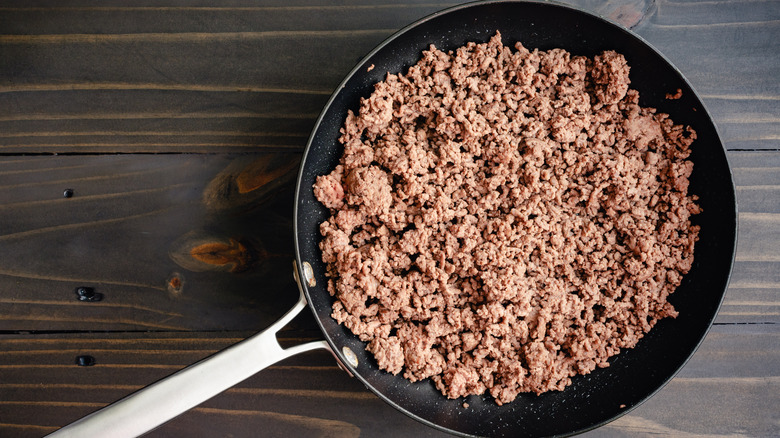 cooked ground beef in skillet