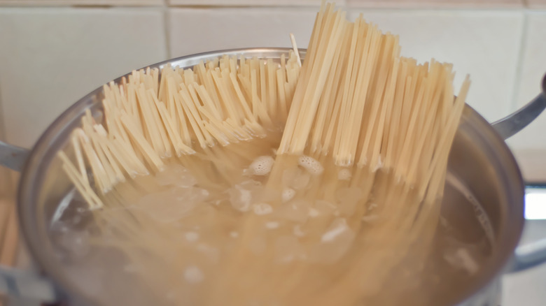 spaghetti cooking in large pot