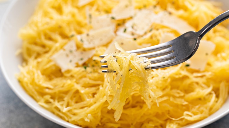 forkful of spaghetti squash with butter and herbs