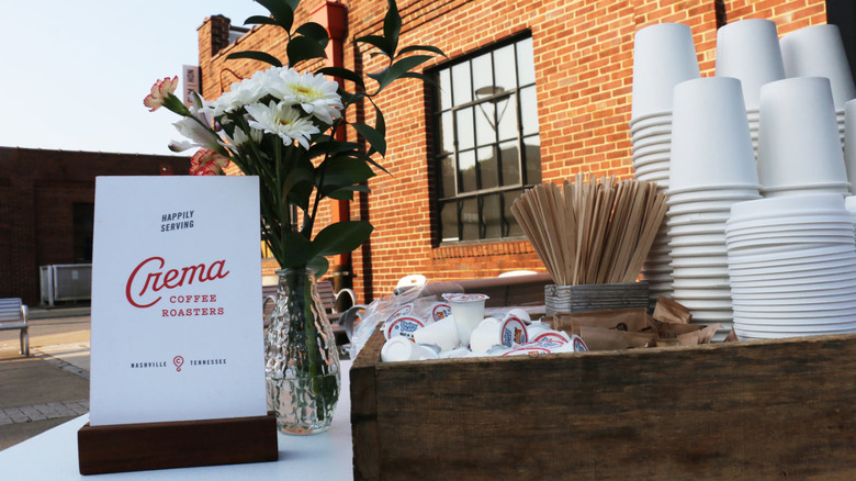 Crema's stocked coffee cream and sugar station