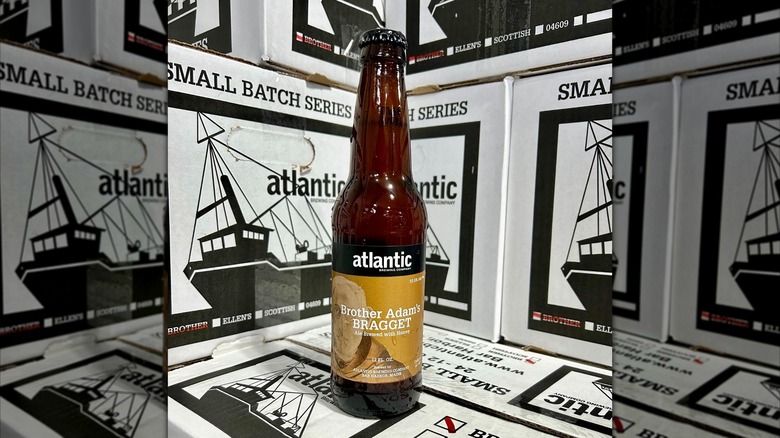 A bottle of Brother Adam's bragget in front of Atlantic Brewing Company shipping boxes