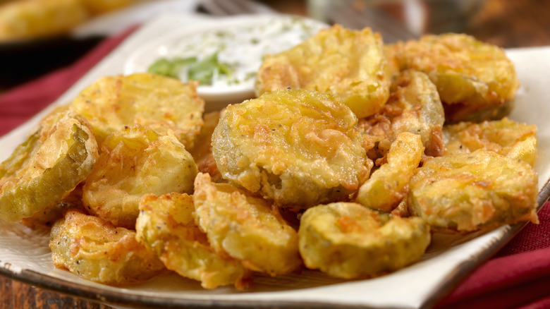 fried pickles on a white plate