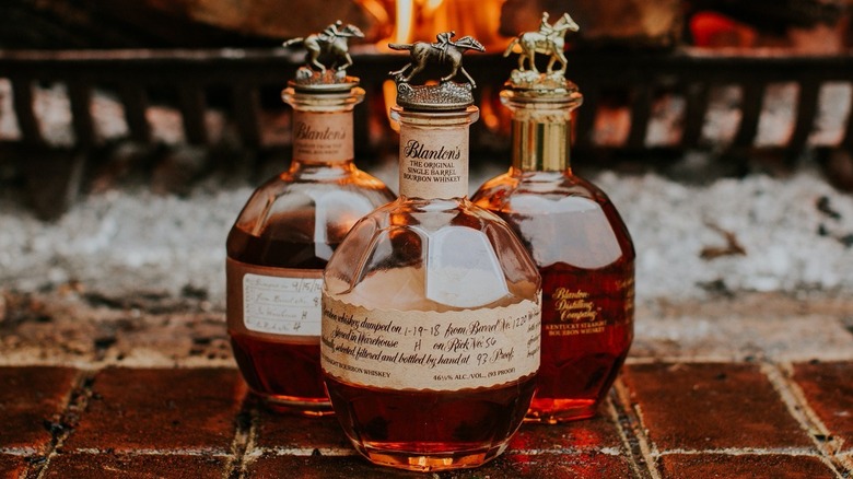 Bottles of Blanton's in front of fireplace