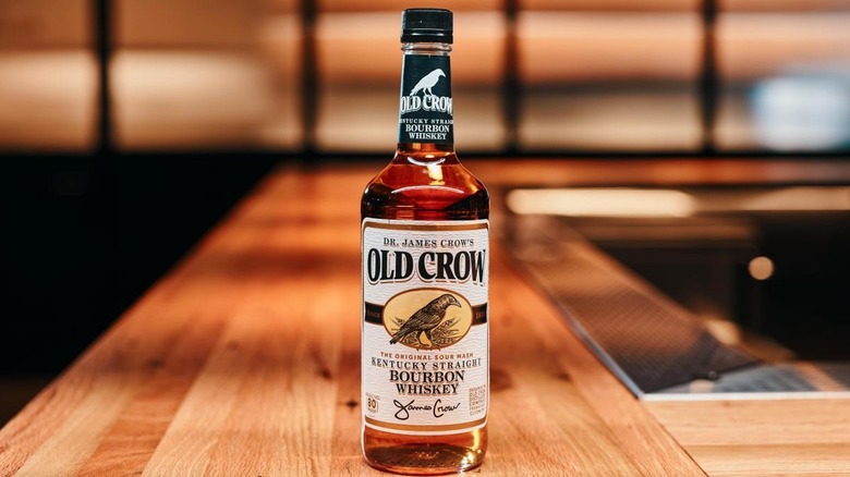 Bottle of Old Crow Kentucky Straight Bourbon Whiskey on bar top