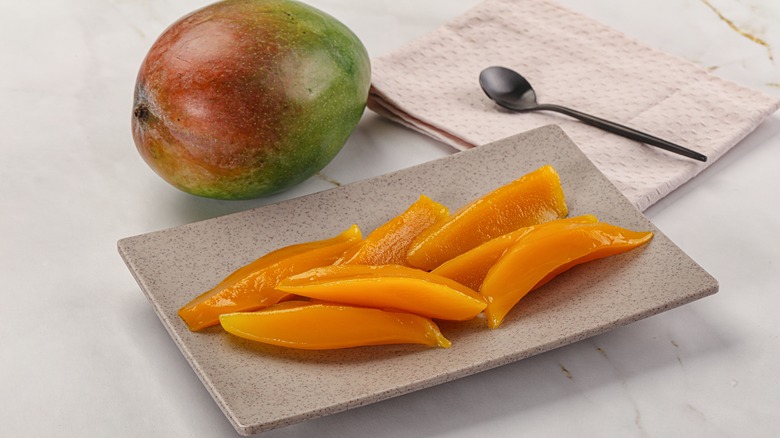 Sliced mango on plate