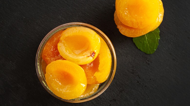 Canned peaches in a bowl