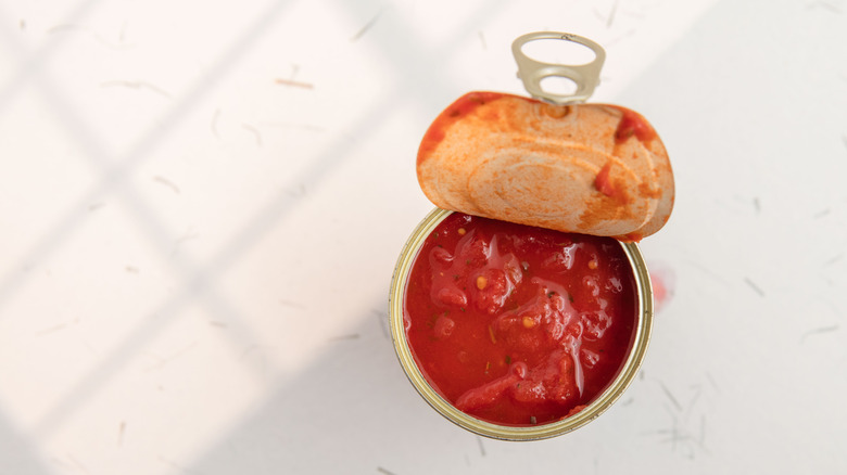 open can of tomato sauce