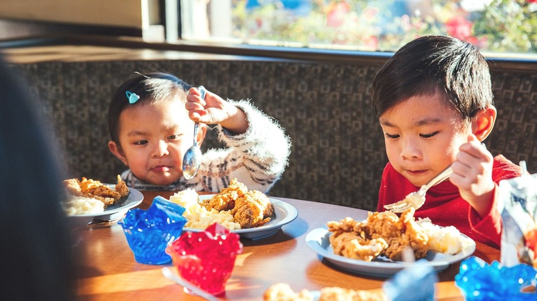 Kids eating at restaurant