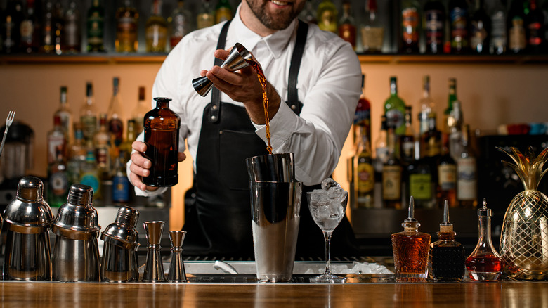Bartender mixing cocktail