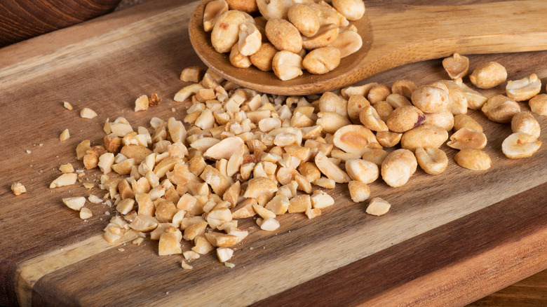 Crushed peanuts on cutting board