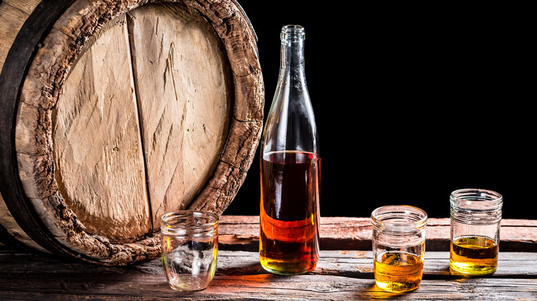 Aged whiskey with barrel 