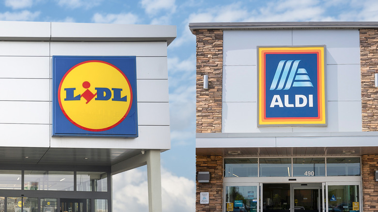 Storefronts of Lidl and Aldi against blue sky