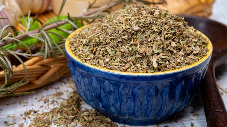 blue bowl filled with Herbs de Provence