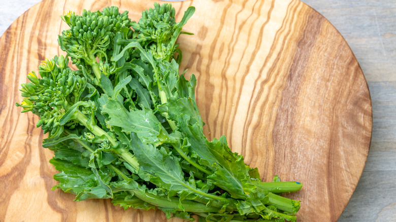 broccoli rabe on wooden cutting board