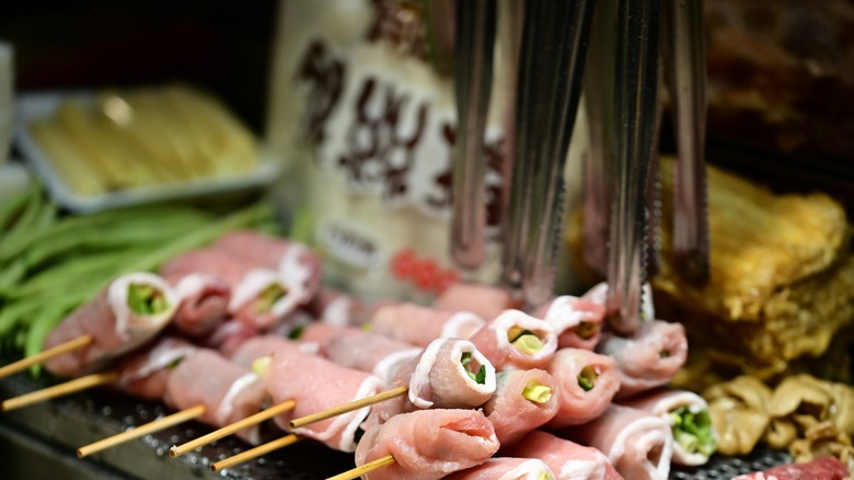 meat skewers in food stall