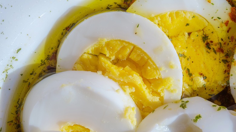 Hard-boiled eggs in olive oil