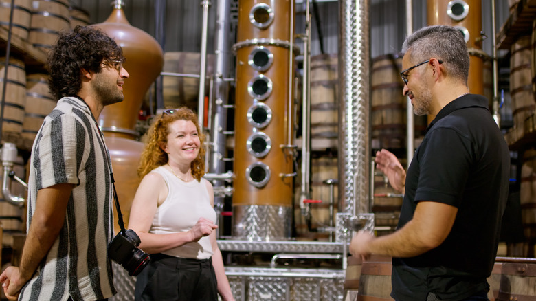 People touring a whiskey distillery