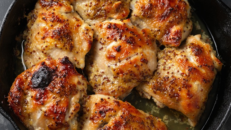 Chicken thighs in pan