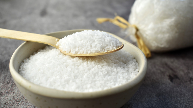 Coarse grain salt in rustic bowl