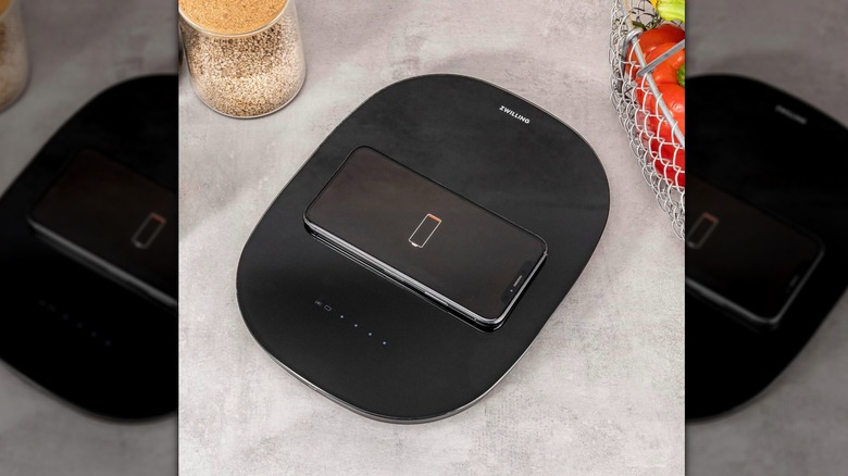 iPhone charging on a digital food scale