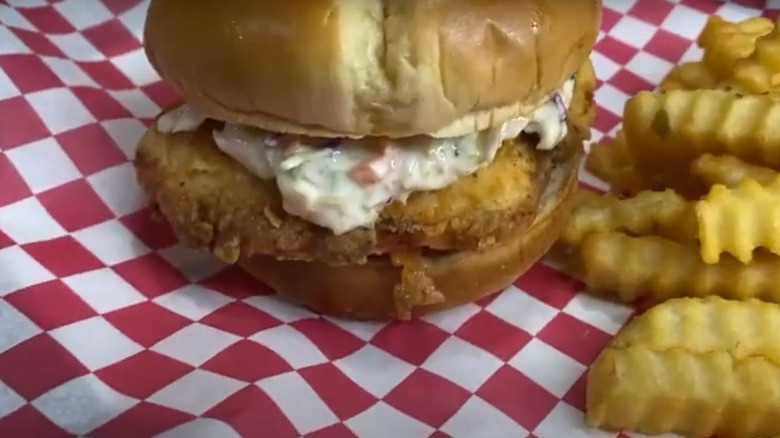 Fried salmon sandwich with coleslaw