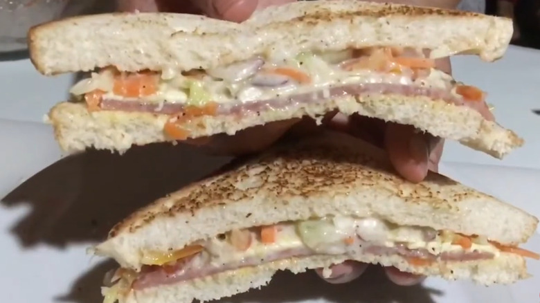 Ham and cheddar and coleslaw sandwich