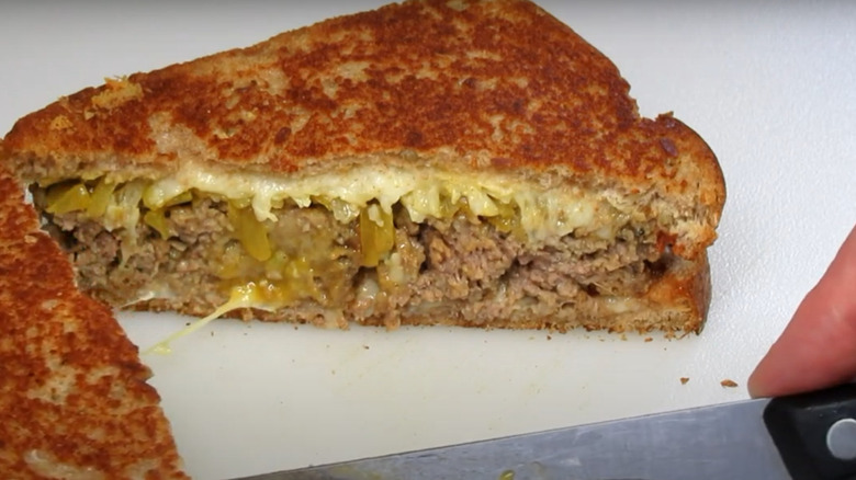 Knife cutting into meatload