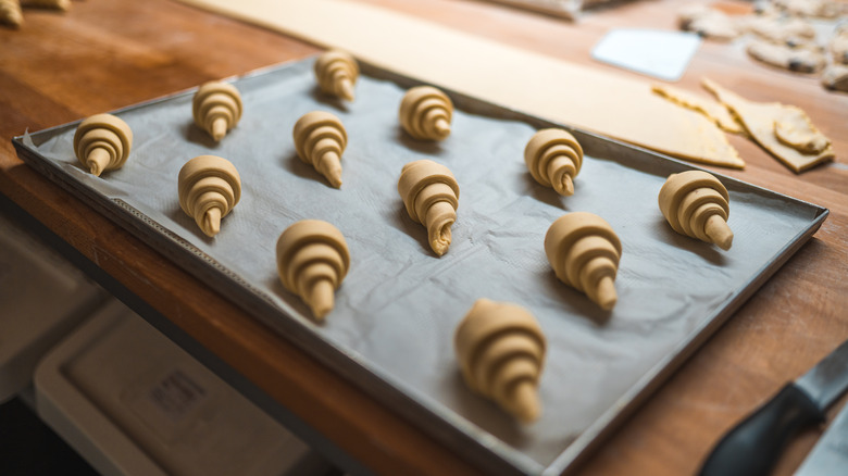 croissants on a parchment lined baking sheet