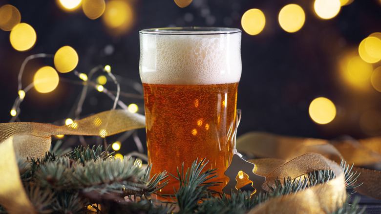 Glass of beer with Christmas ornaments