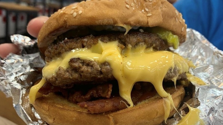 A gooey cheeseburger from Five Guys