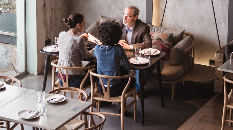 table of three in restaurant