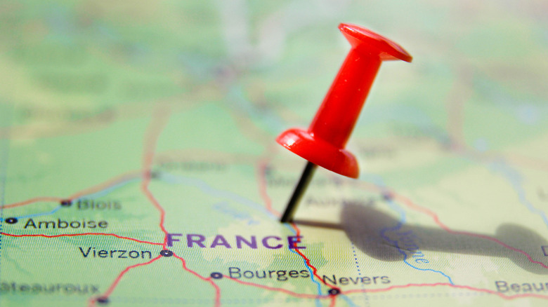 thumb tack on France map