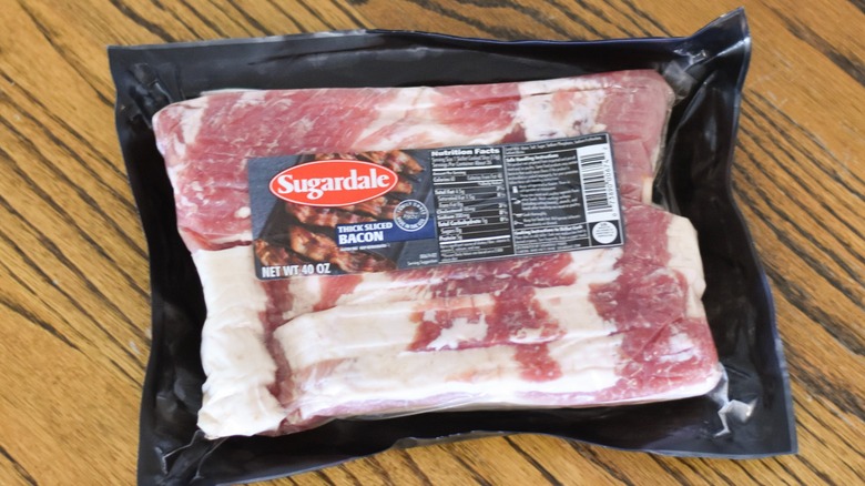 A package of Sugardale bacon on a wooden table