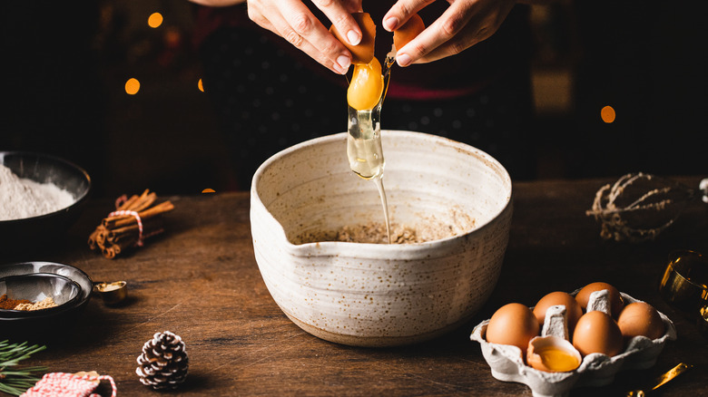 Cracking an egg into a bowl