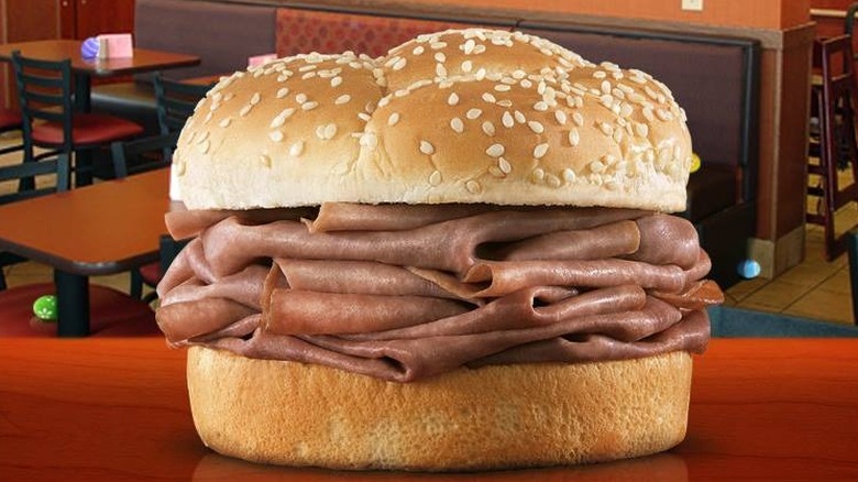 An Arby's Roast Beef sandwich sitting on a table in the restaurant