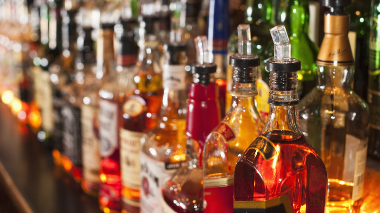 Whiskey bottles on a bar shelf