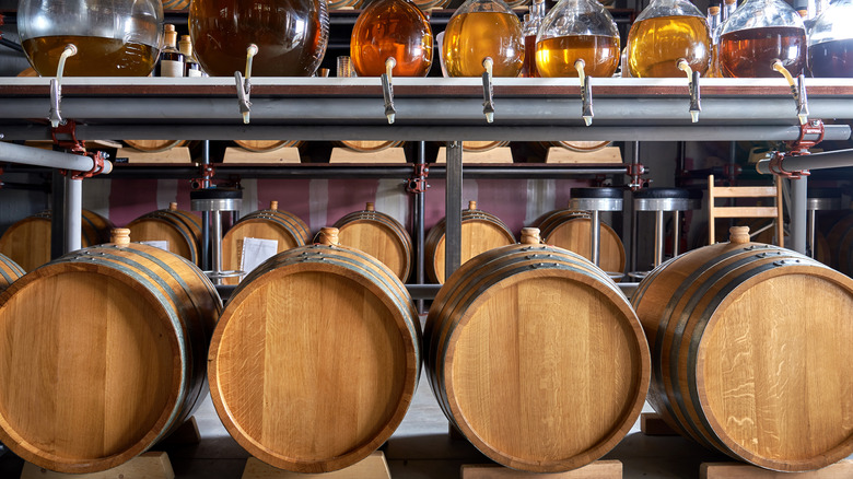 Bourbon barrels and flasks of bourbon