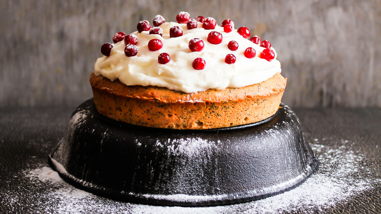 cranberry cake on upside down cast iron pan