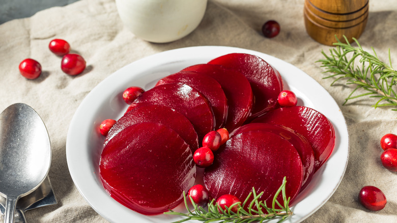 plate of sliced cranberry jelly on white plate