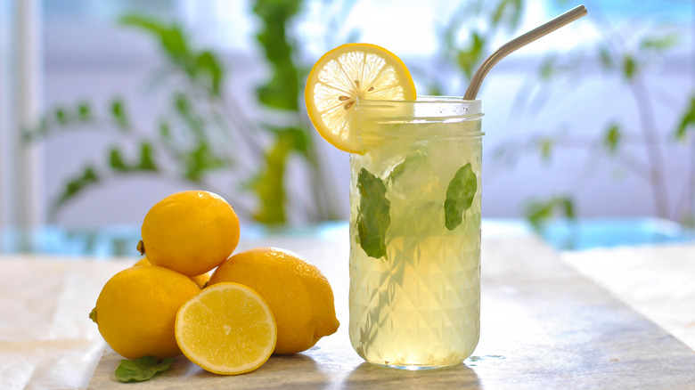 Glass of lemonade with lemons