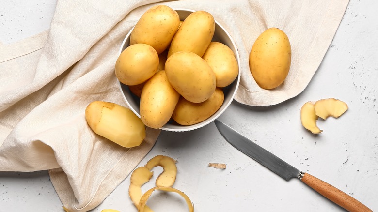 Bowl of potatoes and knife